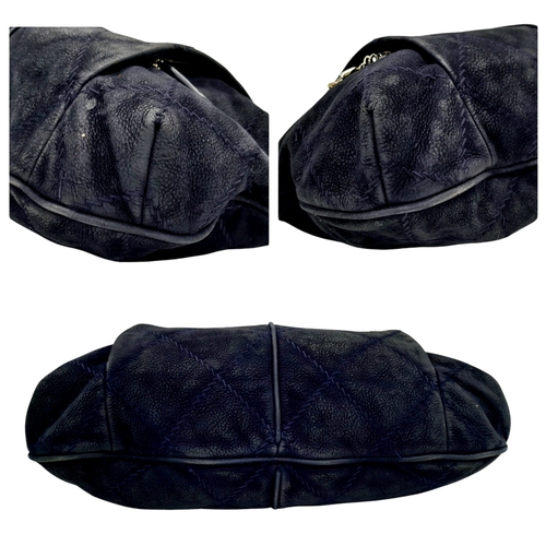 54 - A Chanel Dark Blue Tote Bag. Quilted leather exterior with silver-toned hardware, single chain and l... 