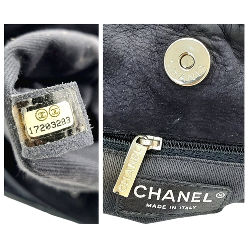 54 - A Chanel Dark Blue Tote Bag. Quilted leather exterior with silver-toned hardware, single chain and l... 