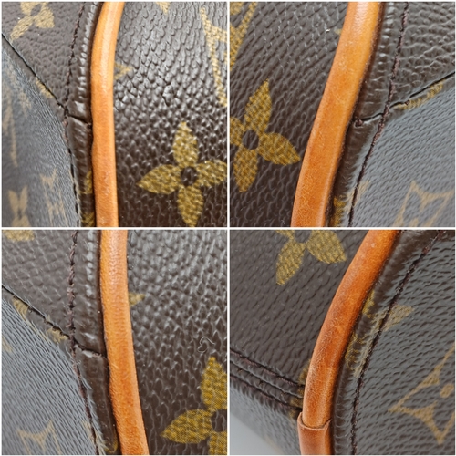 124 - A Louis Vuitton Monogram Ellipse Bag. Coated canvas exterior with leather trim, gold-toned hardware,... 