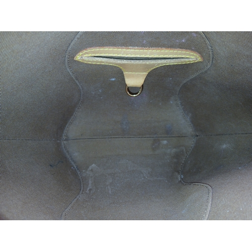 124 - A Louis Vuitton Monogram Ellipse Bag. Coated canvas exterior with leather trim, gold-toned hardware,... 