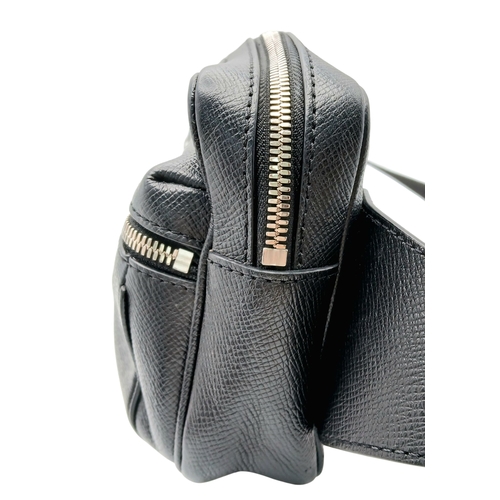160 - A Louis Vuitton Black Monogram Bum Bag/Fanny Pack. Coated canvas and leather exterior with silver-to... 