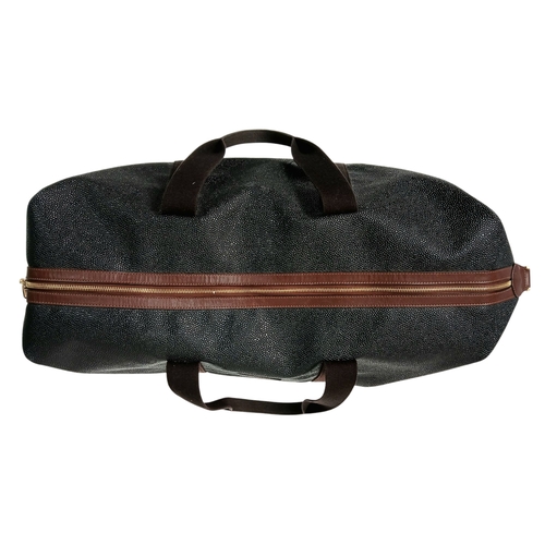 153 - A Mulberry Black Weekend Bag. Pebbled leather exterior with gold-toned hardware, two textile handles... 