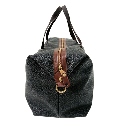 153 - A Mulberry Black Weekend Bag. Pebbled leather exterior with gold-toned hardware, two textile handles... 