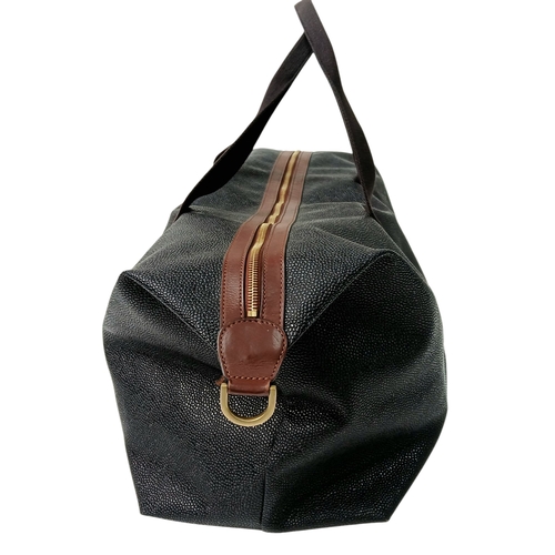 153 - A Mulberry Black Weekend Bag. Pebbled leather exterior with gold-toned hardware, two textile handles... 