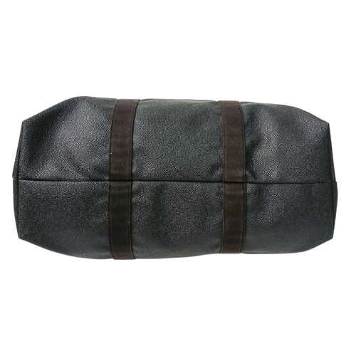 153 - A Mulberry Black Weekend Bag. Pebbled leather exterior with gold-toned hardware, two textile handles... 