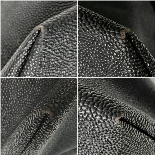 153 - A Mulberry Black Weekend Bag. Pebbled leather exterior with gold-toned hardware, two textile handles... 