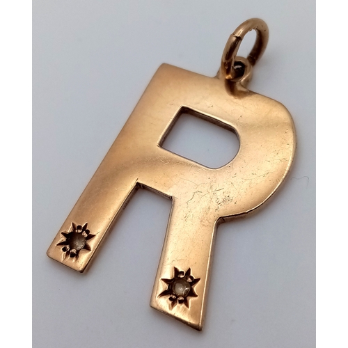 42 - Impressive 9 CARAT GOLD Gem Set LETTER  ‘R’. PENDANT. 6.5 grams. 3 cm x 2.0 cm approx.