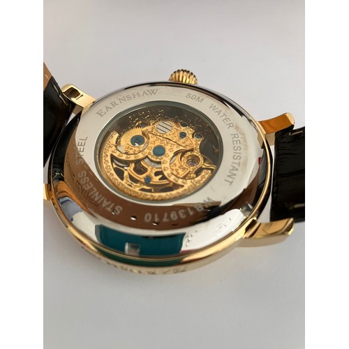 14 - Gentleman’s THOMAS EARNSHAW AUTOMATIC SKELETON WRISTWATCH. Finished in gold tone. Having large bold ... 