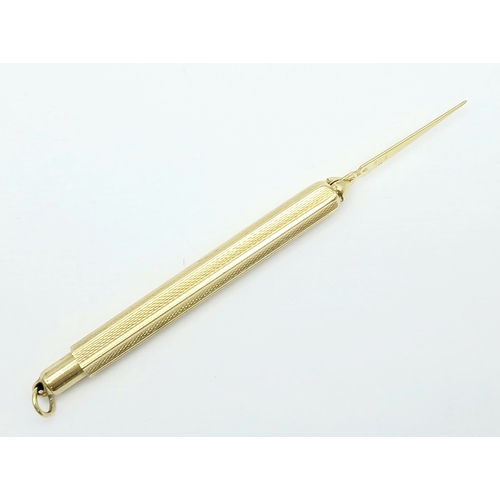 129 - A Fascinating 14K Gold Retractable Toothpick Pendant! 6.5cm retracted. 6.1g.