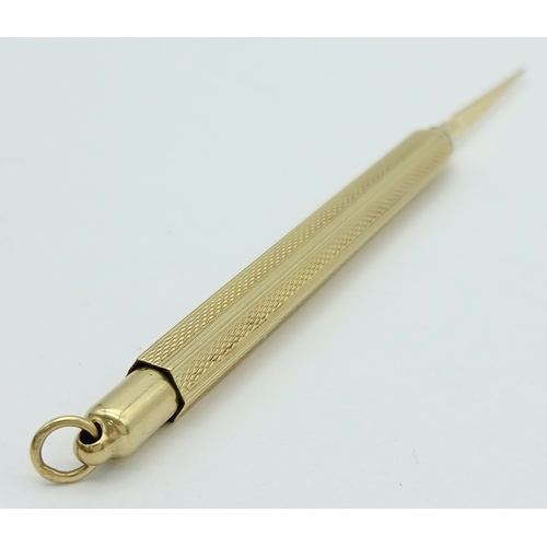 129 - A Fascinating 14K Gold Retractable Toothpick Pendant! 6.5cm retracted. 6.1g.