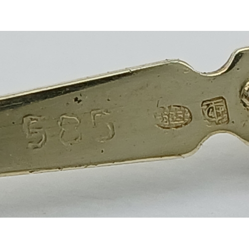 129 - A Fascinating 14K Gold Retractable Toothpick Pendant! 6.5cm retracted. 6.1g.