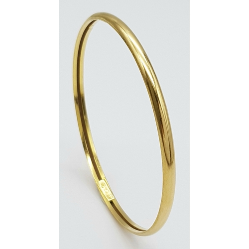 158 - A 22K Yellow Gold Bangle. 3.5mm band width, 58mm inner diameter. 7.8g weight.