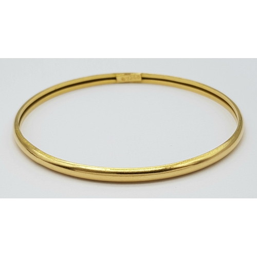 158 - A 22K Yellow Gold Bangle. 3.5mm band width, 58mm inner diameter. 7.8g weight.