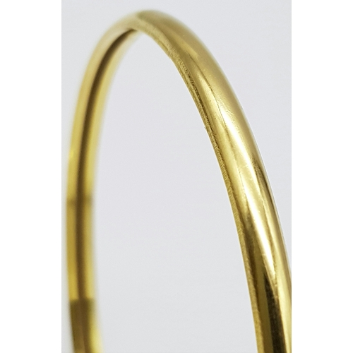 158 - A 22K Yellow Gold Bangle. 3.5mm band width, 58mm inner diameter. 7.8g weight.
