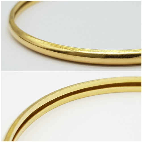 158 - A 22K Yellow Gold Bangle. 3.5mm band width, 58mm inner diameter. 7.8g weight.