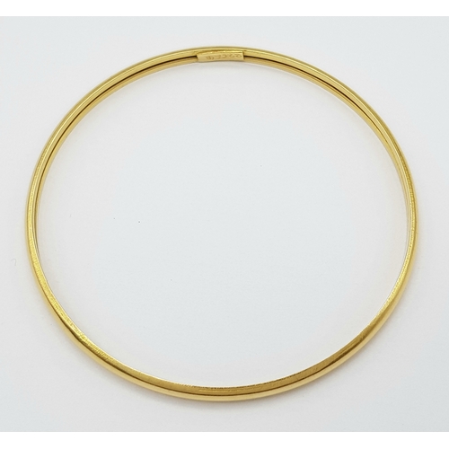 158 - A 22K Yellow Gold Bangle. 3.5mm band width, 58mm inner diameter. 7.8g weight.