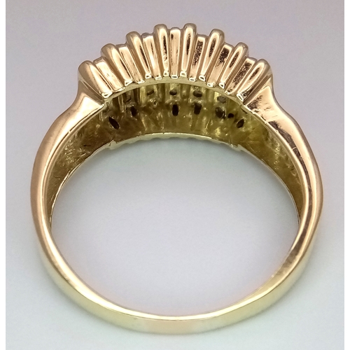 165 - A 10K Yellow Gold Graduating Channel Set Diamond Ring. Size R. 4.52g total weight.