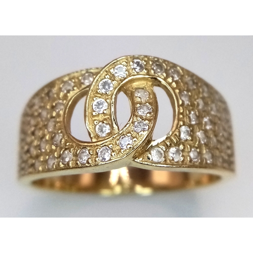 24 - A 14K Yellow Gold Interlocking Diamond Ring. Size S. 4.91g total weight.