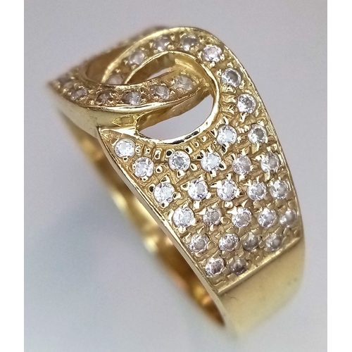 24 - A 14K Yellow Gold Interlocking Diamond Ring. Size S. 4.91g total weight.