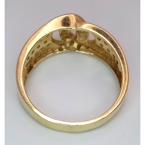 24 - A 14K Yellow Gold Interlocking Diamond Ring. Size S. 4.91g total weight.
