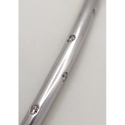 19 - AN 18K WHITE GOLD DIAMOND SET BANGLE. 9.1G. SC-1070