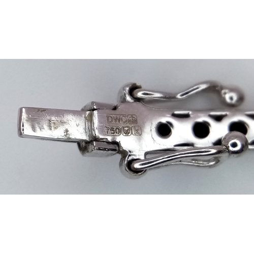 19 - AN 18K WHITE GOLD DIAMOND SET BANGLE. 9.1G. SC-1070