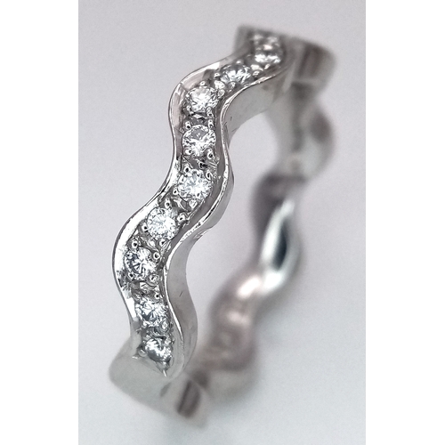 40 - AN 18K WHITE GOLD WAVY DIAMOND BAND RING - 0.20CTW. 5.5G. SIZE L. SC - 1096.