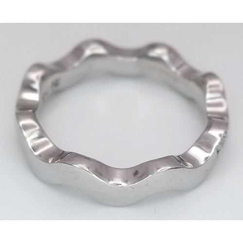 40 - AN 18K WHITE GOLD WAVY DIAMOND BAND RING - 0.20CTW. 5.5G. SIZE L. SC - 1096.