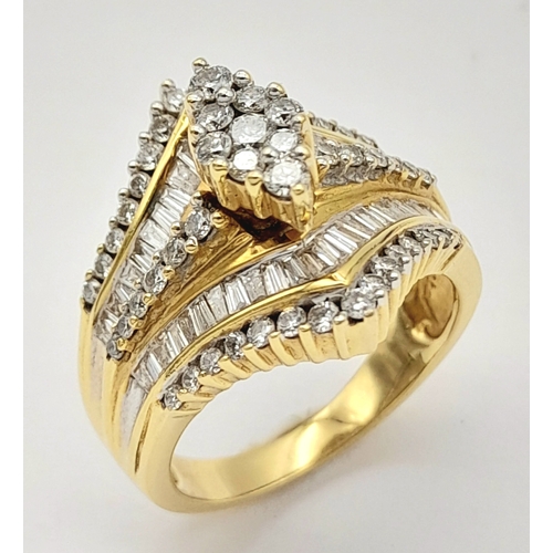 13 - An 18K Yellow Gold and Diamond Ring. Shield form diamond mirrored setting with tapered baguette and ... 