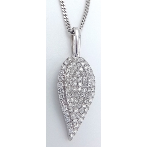 29 - An 18K White Gold Diamond Leaf Form Pendant on an 18K Gold Disappearing White Necklace. c.0.90ctw. 2... 