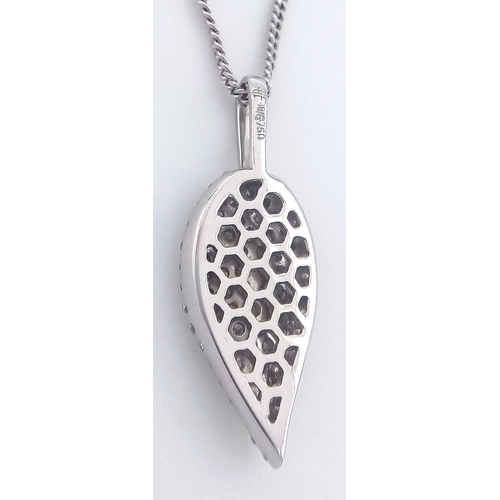 29 - An 18K White Gold Diamond Leaf Form Pendant on an 18K Gold Disappearing White Necklace. c.0.90ctw. 2... 
