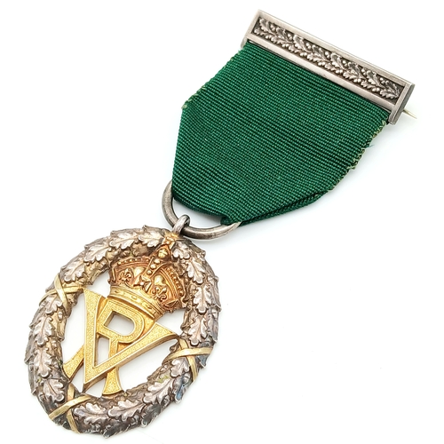 31 - A Volunteer Officers' Decoration (VR cipher); with hallmarks for 1892. Complete with top bar/brooch ... 