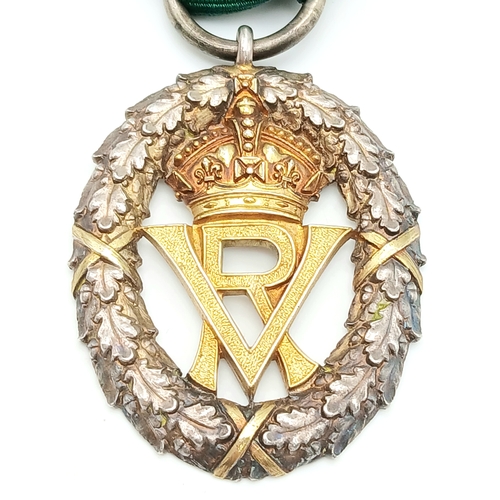 31 - A Volunteer Officers' Decoration (VR cipher); with hallmarks for 1892. Complete with top bar/brooch ... 