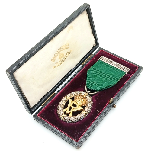 31 - A Volunteer Officers' Decoration (VR cipher); with hallmarks for 1892. Complete with top bar/brooch ... 