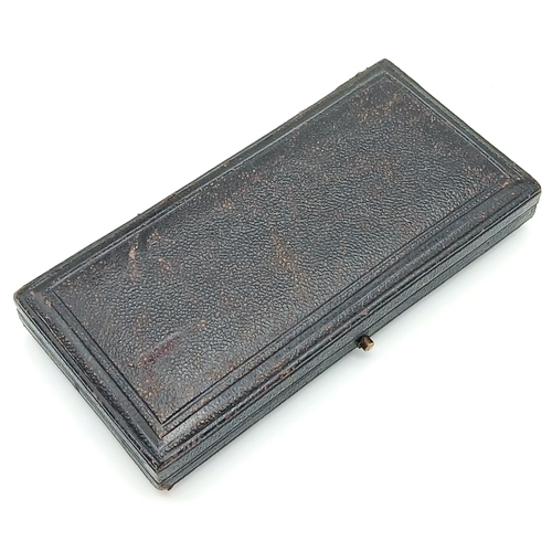 31 - A Volunteer Officers' Decoration (VR cipher); with hallmarks for 1892. Complete with top bar/brooch ... 