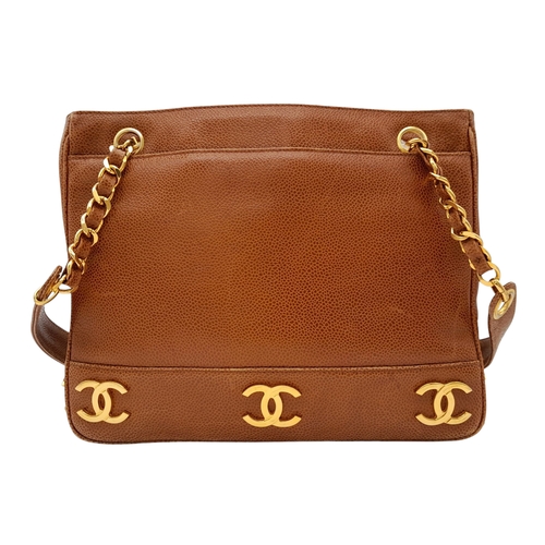 41 - A Chanel Brown Caviar Leather Shoulder Bag. Grained leather exterior with gold-toned hardware, dual ... 