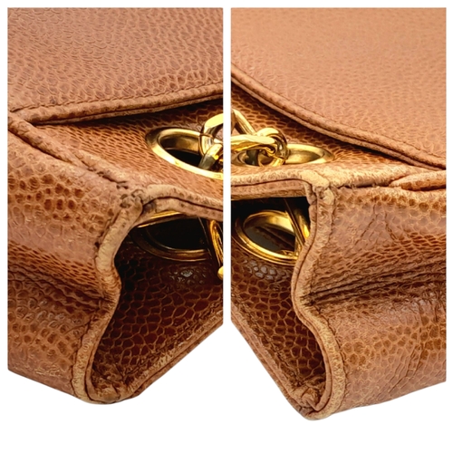 41 - A Chanel Brown Caviar Leather Shoulder Bag. Grained leather exterior with gold-toned hardware, dual ... 