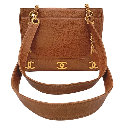 41 - A Chanel Brown Caviar Leather Shoulder Bag. Grained leather exterior with gold-toned hardware, dual ... 
