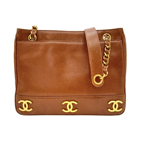 41 - A Chanel Brown Caviar Leather Shoulder Bag. Grained leather exterior with gold-toned hardware, dual ... 