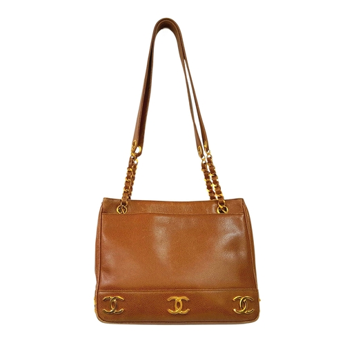41 - A Chanel Brown Caviar Leather Shoulder Bag. Grained leather exterior with gold-toned hardware, dual ... 