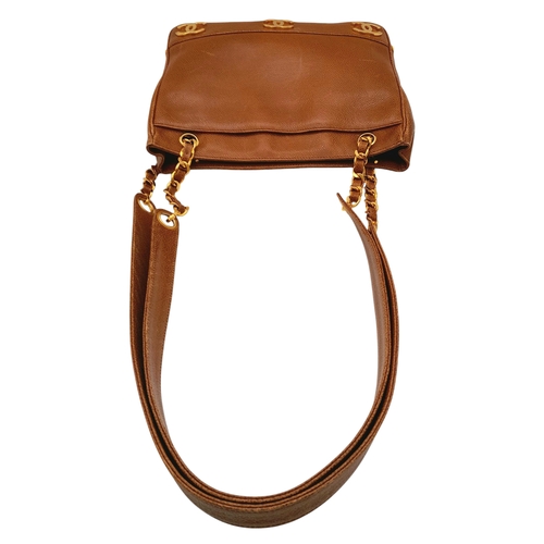 41 - A Chanel Brown Caviar Leather Shoulder Bag. Grained leather exterior with gold-toned hardware, dual ... 