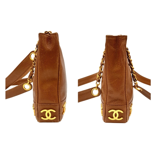 41 - A Chanel Brown Caviar Leather Shoulder Bag. Grained leather exterior with gold-toned hardware, dual ... 