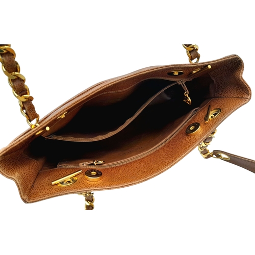 41 - A Chanel Brown Caviar Leather Shoulder Bag. Grained leather exterior with gold-toned hardware, dual ... 