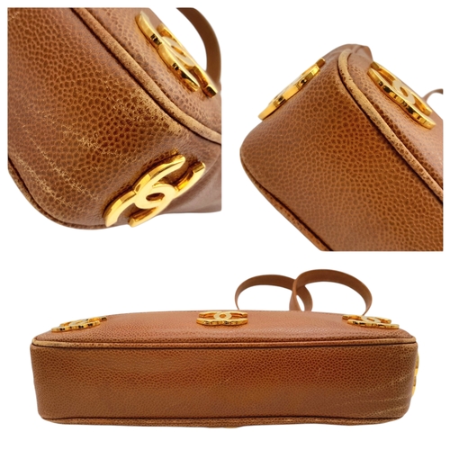 41 - A Chanel Brown Caviar Leather Shoulder Bag. Grained leather exterior with gold-toned hardware, dual ... 