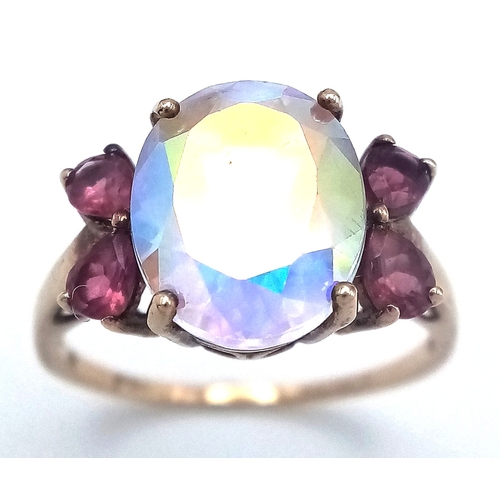 42 - Stunning 9 CARAT GOLD RING. Having large oval cut Mystic crystal set to top. Full UK hallmark. 3.7 g... 