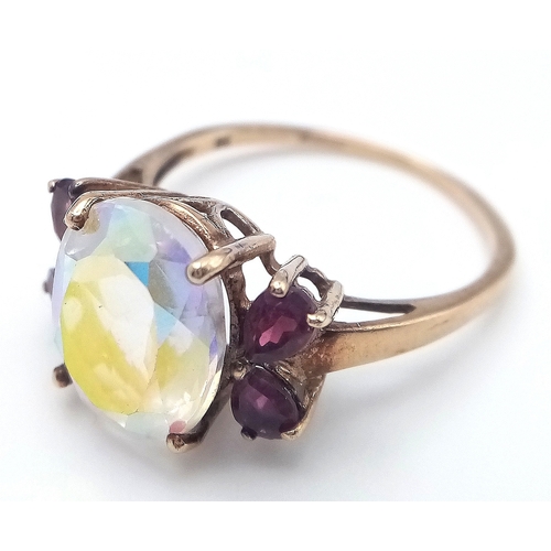 42 - Stunning 9 CARAT GOLD RING. Having large oval cut Mystic crystal set to top. Full UK hallmark. 3.7 g... 