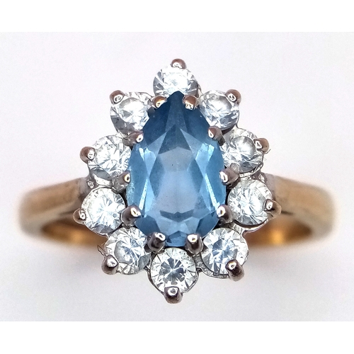 11 - A 9K Yellow Gold, Aquamarine and White Stone Ring. Size M 1/2. 3.2g total weight.