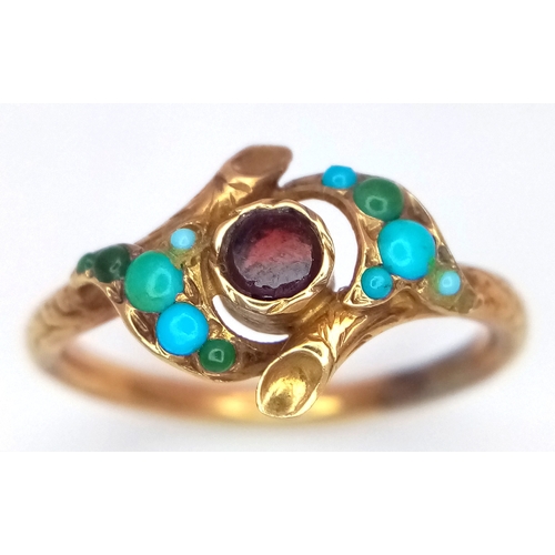 25 - An Antique 18K Gold (tested) Turquoise and Garnet Ring. Central garnet with graduating turquoise cab... 