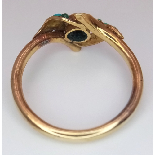 25 - An Antique 18K Gold (tested) Turquoise and Garnet Ring. Central garnet with graduating turquoise cab... 