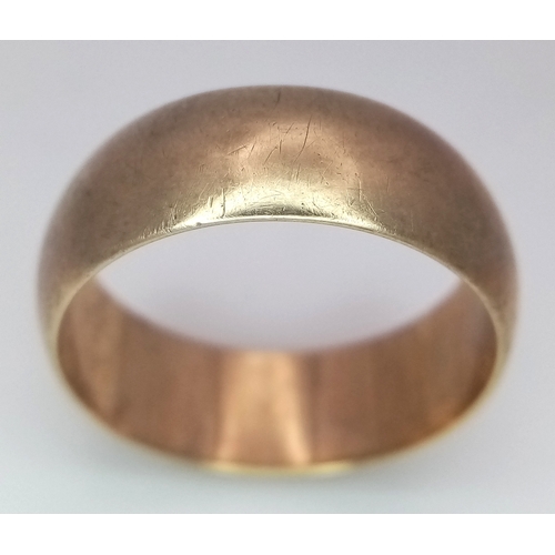9 - A 9K Yellow Gold Band Ring. Full UK hallmarks. 8mm width. Size U. 6.9g.
